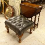 A small oak oval drop leaf table, on barley twist legs, and a green leather-upholstered footstool (