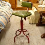 A mid-century tubular metal swivel machinist's chair