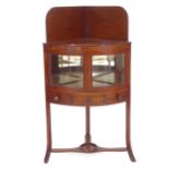 A Victorian mahogany corner washstand, with glazed doors and drawer under, W55cm, H101cm, D38cm