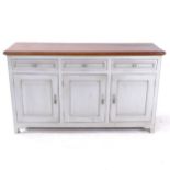 A painted dresser base with polished top, having 3 frieze drawers, and cupboards under, L150cm,