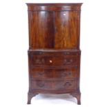 A 1920s mahogany cabinet on chest, of serpentine form, with bracket feet, W68cm, H128cm, D45cm