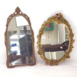 A gilt-gesso oval wall mirror, and 3 miniature gesso hanging cherubs, and a metal arch-top wall