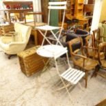 A circular painted metal folding garden table, and 2 matching folding chairs