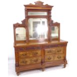 A Victorian walnut triple mirror-back sideboard, base fitted with 6 short drawers, on bun feet,
