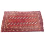 A red ground Afghan design rug, 145cm x 90cm