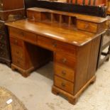 An Antique mahogany kneehole writing desk, with 8 fitted drawers, W122cm, H92cm, D96cm