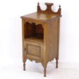 An Arts and Crafts oak bedside cupboard, W41cm, H91cm, D39cm