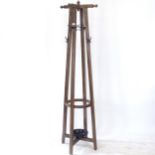 An oak Arts and Crafts style hat and coat stand, H188cm