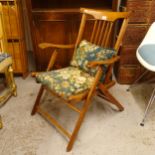 A Vintage folding campaign chair, with upholstered seat and matching cushion