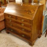 A George III mahogany and satinwood-banded bureau, with 2 short and 3 long drawers under, on ogee