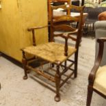 A 19th century Chippendale armchair with rush seat