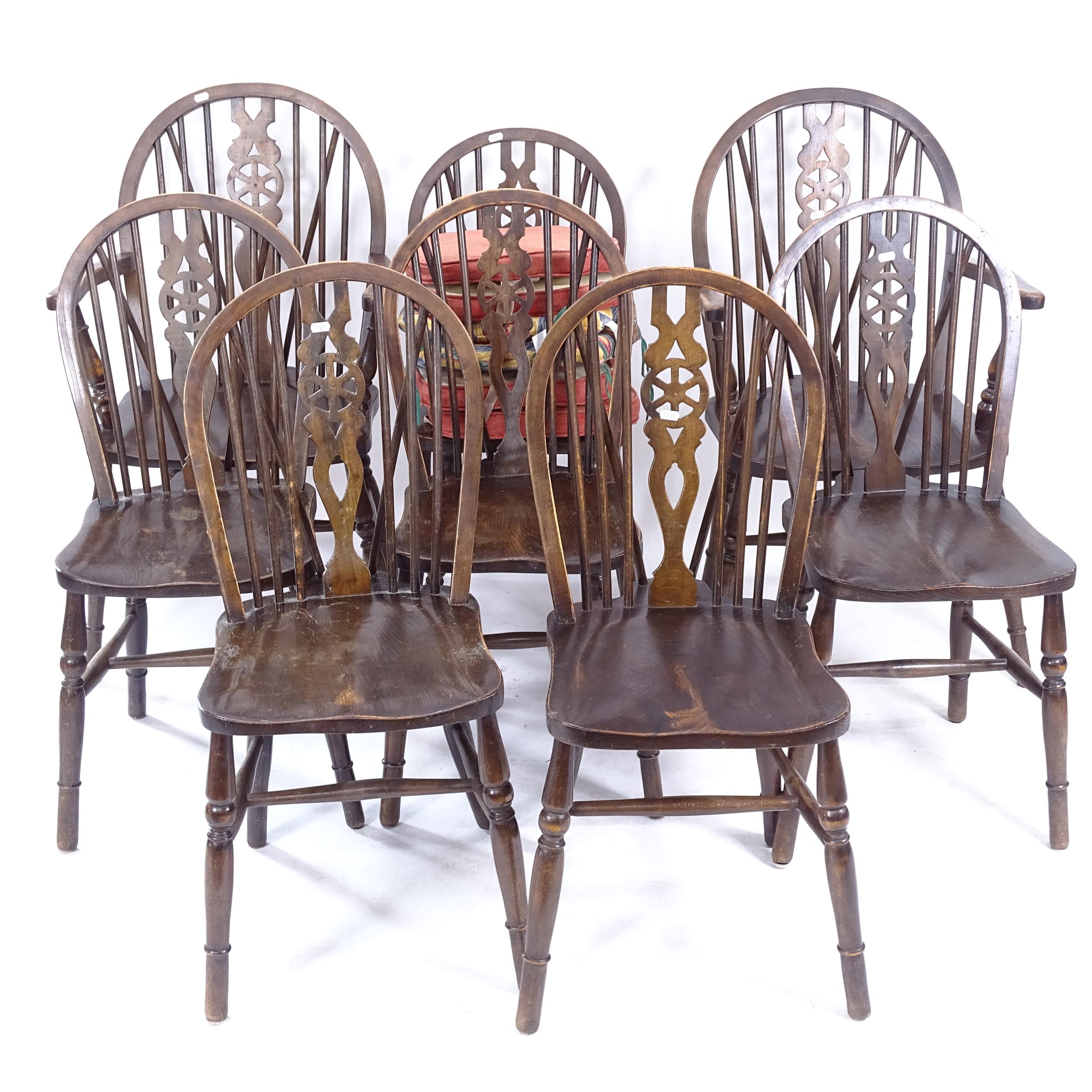 A set of 8 oak and elm-seated wheel-back dining chairs (6 and 2)