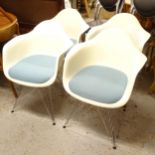 A set of 4 Vitra Eames DAR plastic armchairs, designed by Charles and Ray Eames, with paper label