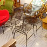 A set of 4 wrought-iron garden chairs