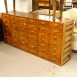 A Vintage pine bank of 42 short drawers, L184cm, H86cm, D40cm