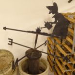 A wrought-iron weather vane