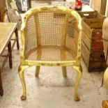 A Chinese design painted and chinoiserie decorated bow-arm chair, with cane panelling, on cabriole