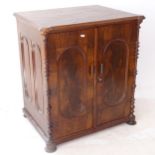 An Antique mahogany 2-door cabinet, with oval panels, turned columns, and later top, W70cm, H76cm,