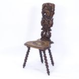 An Italian design hall chair, with carved back and seat, and barley twist legs