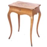 A small Antique rosewood sewing table of shaped form, with marquetry decorated top, raised on