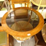 A mid-century circular teak coffee table, with an inset smoked glass top, W76cm, H42cm