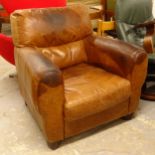 A brown leather-upholstered Club chair