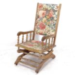 An American beech rocking chair, with floral upholstery