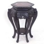 A Chinese carved wood octagonal jardiniere stand