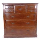 A large Edwardian mahogany chest, with central hat drawer, 4 short and 3 long drawers, W122cm,