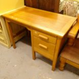 A 1930s oak single-pedestal writing desk, W107cm, H76cm, D60cm