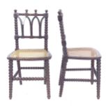 A pair of Victorian Gothic bobbin turned side chairs with caned seats