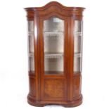 A mahogany bow-end display cabinet, with arch-top glazed and panelled door, and 2 fitted shelves,