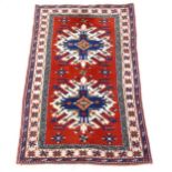 A red ground Bokora rug, 183cm x 110cm