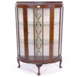 A 1930s mahogany bow-front display cabinet, with single-glazed door, W78cm, H114cm, D29cm