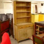 A Vintage pine and ply panelled dresser, with open shelves, and drawer and cupboard under (this is a