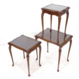 A walnut nest of 3 occasional tables, with inset glass tops, on cabriole legs, widest 54cm