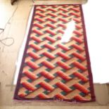 A red and cream ground flatweave Kilim carpet, 308cm x 164cm