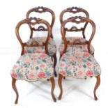 A set of 4 Victorian mahogany balloon-back dining chairs, with cabriole legs