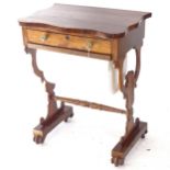 A Regency rosewood sewing table, having a shaped top, with single frieze drawer and basket under
