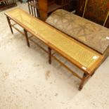 A Victorian mahogany and cane-panelled bench, on 8 turned legs, L184cm, H45cm, D33cm