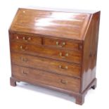 A Georgian mahogany bureau, with fitted interior, and 2 short and 3 long drawers under, W112cm,
