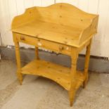A pine washstand, with raised back and single drawer, W86cm, H102cm, D43cm