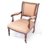 A late Victorian rosewood and upholstered open armchair