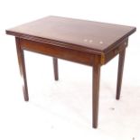 A mahogany and stained wood fold over dining table, with single end frieze drawer (later top),