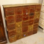 A Vintage pine bank of 25 drawers, W102cm, H102cm, D28cm