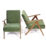 A pair of mid-century lounge chairs, with V-shaped legs, later upholstered in green velvet