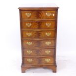 A reproduction mahogany narrow chest of 6 drawers of serpentine form, W54cm, H99cm, D43cm