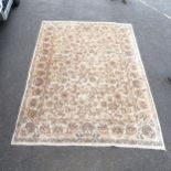 A large cream ground carpet, with symmetrical border and floral scrolled design, 365cm x 274cm