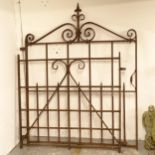 A scrolled wrought-iron side gate, width including hinge mount 115cm, H141cm, and a small wrought-