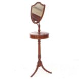 A late Victorian mahogany and satinwood-strung telescopic shaving stand, with shield-shape mirror,